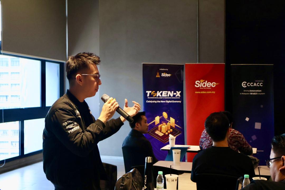 Alvin Ng speaking at Token-X
